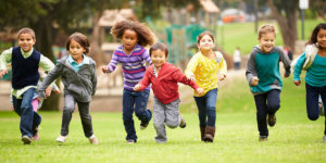 Children running in field